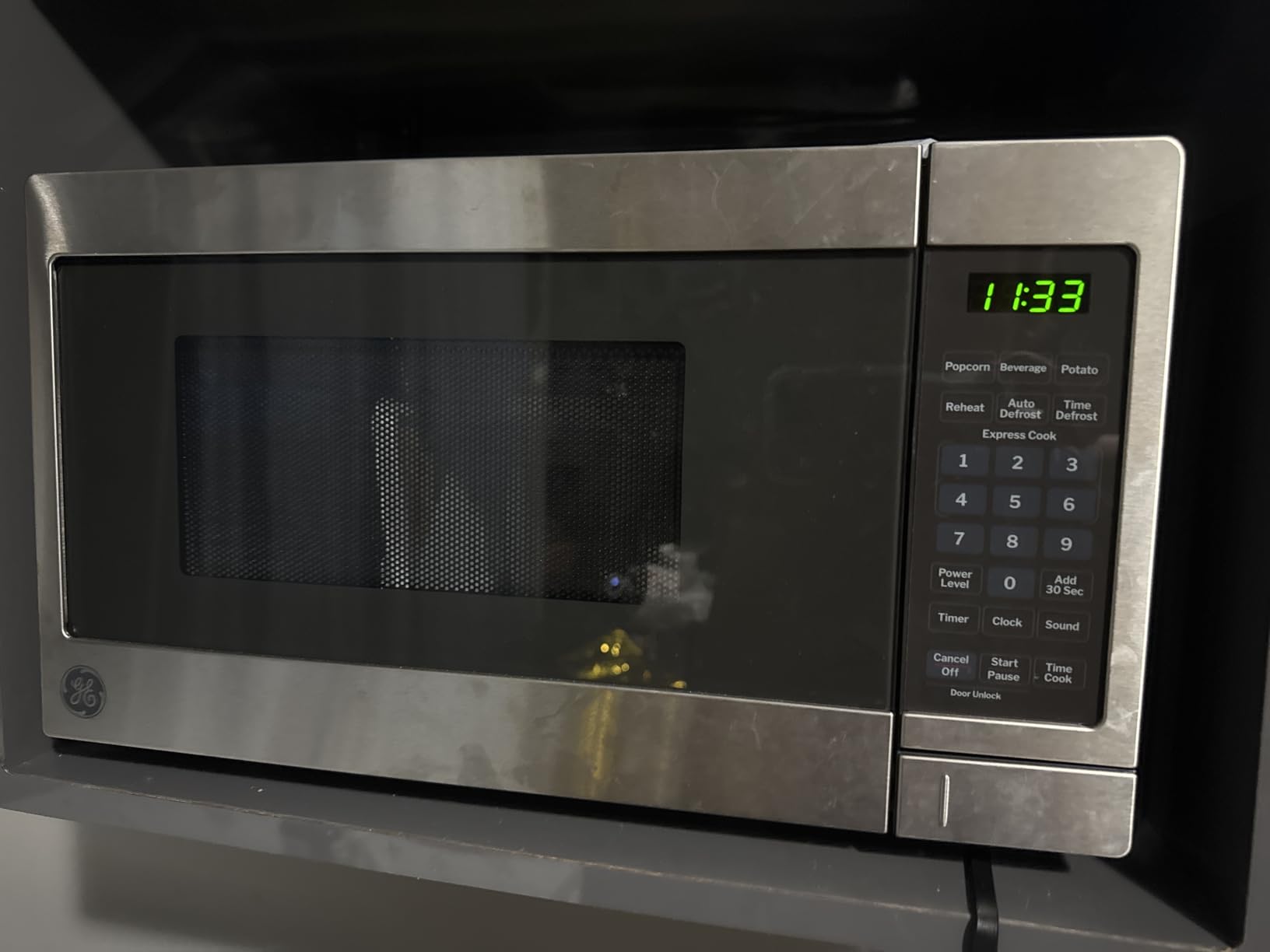 GE Compact Countertop Microwave Oven, 0.7 Cubic Ft., 700-watt Capacity, 6 Auto Cooking Settings, Child-Lock Technology, Dorm Room or Apartment, Stainless Steel - Customer Photo 2